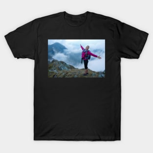 Woman backpacker hiking on a trail T-Shirt